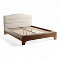 Upholstered bed frame with wooden slats and headboard in natural finish